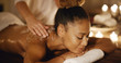 © Dash - African-american woman getting a relaxing massage in salon in slow motion
