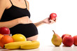 Healthy nutrition and pregnancy. Pregnant woman and red apple