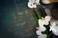 SPA Setting With Blooming White Orchids And Sea Salt. Space For