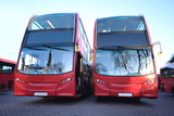 Fototapeta  - Red double decker buses parked at station