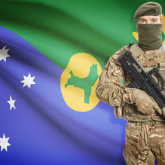 Soldier with machine gun and flag on background - Christmas Island