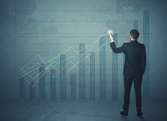 businessman drawing chart