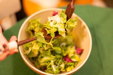 Wall Mural - woman mixing salad