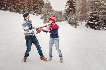 Wall Mural - Happy Couple Having Fun Outdoors in Winter park