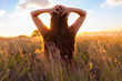 © kieferpix - Young woman enjoy sunshine in wheat field