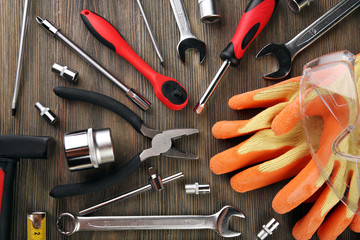 Poster - Different kinds of tools on wooden background, top view