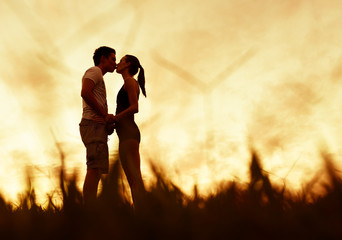 Couple kissing in the park.
