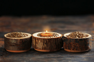 Wall Mural - Burning wooden candle with sea salt, closeup