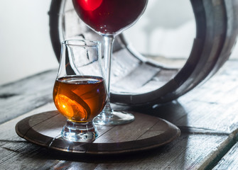 Two wineglasses and old barrel