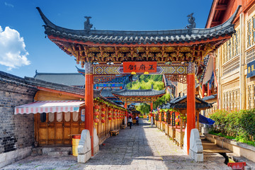 Wall Mural - Traditional Chinese wooden gate, the Old Town of Lijiang, China