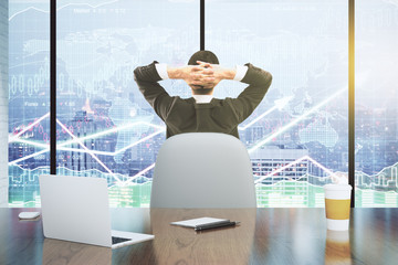 Poster - Businessman looks at the scoreboard with business chart and lapt