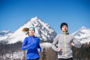 Wall Mural - Young couple jogging