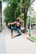 © Eugenio Marongiu - Young handsome afro back man jumping in the street of the city,