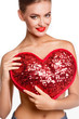 ove and valentines day woman holding heart smiling cute. Portrait of Beautiful woman with bright makeup and red heart in hand
