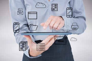 Poster - Composite image of businesswoman using her tablet