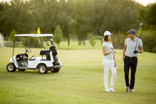 Young Couple At Golf Cart