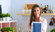 © lenets_tan - Young woman using a tablet computer to cook in her kitchen