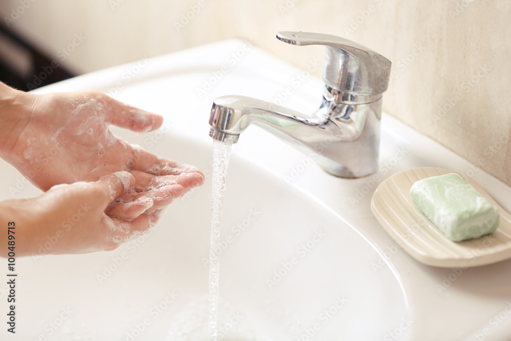 Washing of hands with soap under running water Stock Photo | Adobe Stock