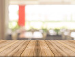 © tirachard - Wooden board empty table in front of blurred background. Perspective brown wood over blur in coffee shop - can be used for display or montage your products.Mock up your products.Vintage filter.