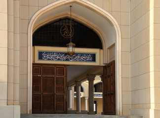 Wall Mural - Entrance to the Muslim mosque. Above the gate inscription from t