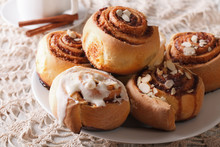 Freshly Cinnamon Rolls With Almond Close Up And Coffee. Horizontal
