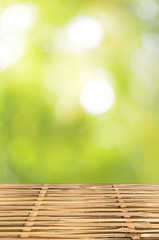 Empty wood table and green bokeh abstract background ,can be used for display your products