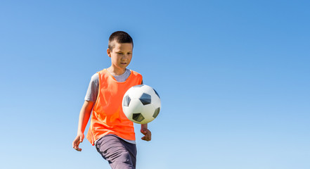 Wall Mural - Boys kicking football