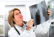Mature doctor woman with a X-ray photograph.