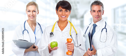 Fototapeta na wymiar Doctor woman with dumbbell and apple.