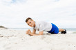 © Sergey Nivens - Man training on beach outside