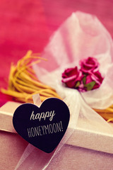 Canvas Print - heart-shaped signboard with the text happy honeymoon