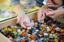 Colored Stones. Round Semi-precious Minerals. Polished Minerals. Beautiful Natural Stones. People With Hand Sorted Stones. Geology And Geography. Semi-precious Stones. A Scattering Of Stones.