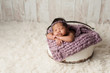 Newborn Girl Sleeping in Wooden Bucket