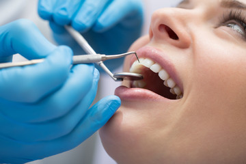 Dentist examining a patient's teeth in the dentist.