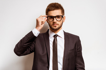 Canvas Print - Young businessman in studio