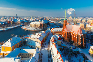 Wall Mural - Aerial view of Old Town and Ostrow Tumski with church of the Holy Cross and St. Bartholomew from Cathedral of St. John in the winter morning in Wroclaw, Poland