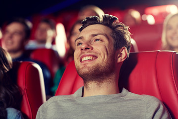 Wall Mural - happy young man watching movie in theater