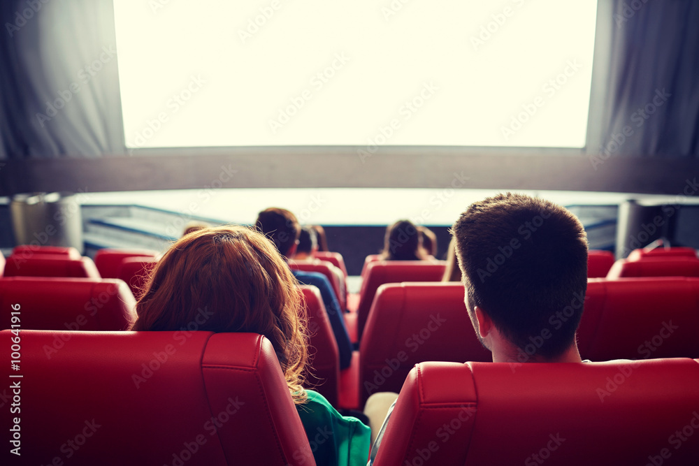happy couple watching movie in theater or cinema - obrazy, fototapety, plakaty 
