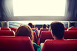 © Syda Productions - happy couple watching movie in theater or cinema