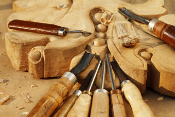 carving tool closeup on wooden background