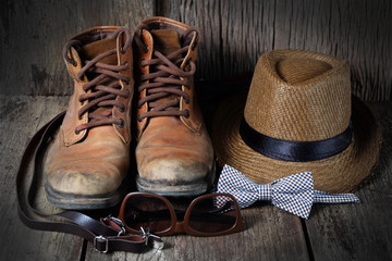 Wall Mural - Shoe hat and accessories travel set on a wooden background