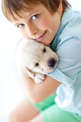 Wall Mural - stylish little  kid with a puppy 