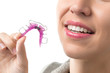 Woman with orthodontic removable brace