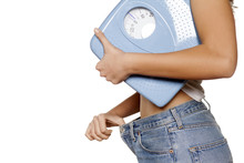  Woman Posing With A Scale And Big  Size Pants