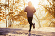 © baranq - Young man running during autumn, winter morning