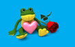 Cute frog sitting with pink heart and red rose, 3d character