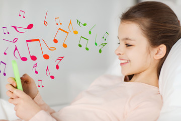 Poster - happy girl lying in bed with smartphone over notes