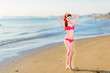 © Aleksei Zakharov - Beautiful young woman bikini pinup at beach