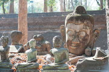 Ancient outdoor broken Buddhas in Wat Umong Suan Puthatham,Chieng Mai Province,Thailand.