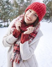 Pretty Woman With Red Hat Smiling In Winter Day
